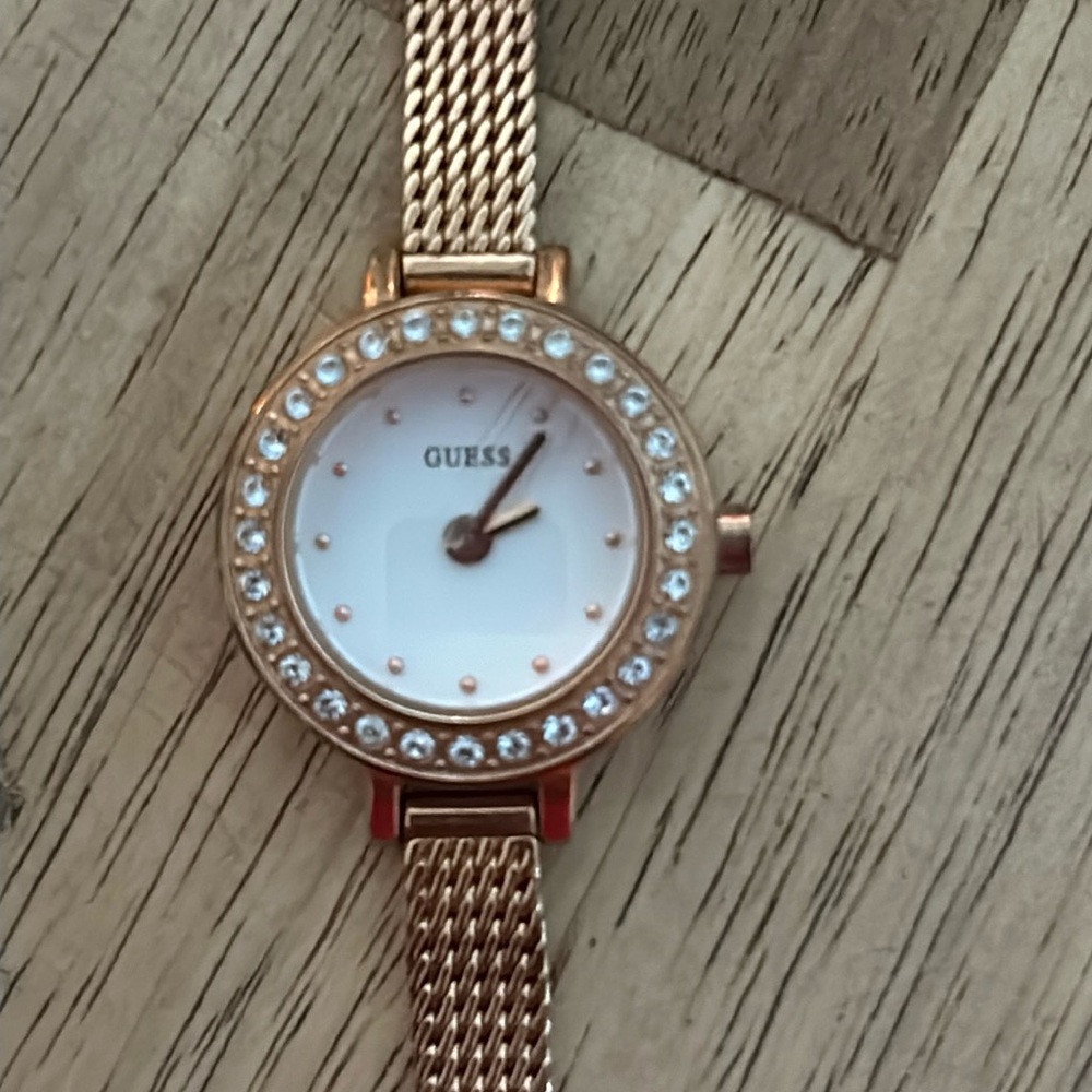 Gold Guess watch with diamonds